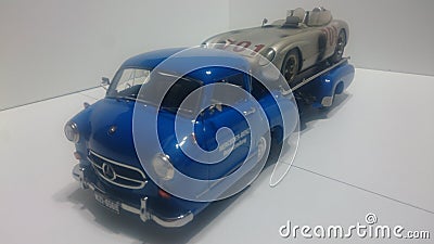 Cmc 1/18 model car - Mercedes Benz transporter Blue wonder and 300 SLR racing car Editorial Stock Photo