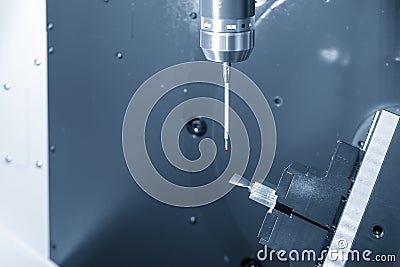 The CMM probe attache on the 5-axis CNC milling machine. Stock Photo