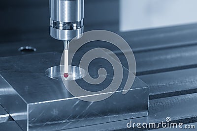 The CMM probe attache on the CNC milling machine fo measuring the mold part. Stock Photo