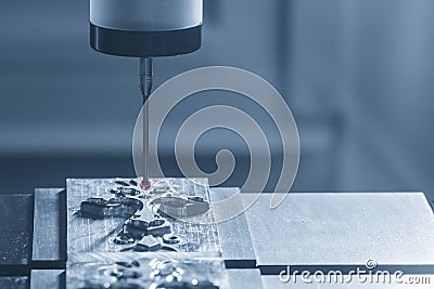 The CMM probe measuring the mold parts on machining center Stock Photo