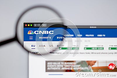 CNBC News logo visible through a magnifying glass. Editorial Stock Photo