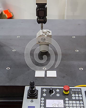 CMM inspecting workpiece Stock Photo