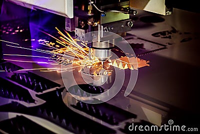 CNC Laser cutting of metal, modern industrial technology. Stock Photo