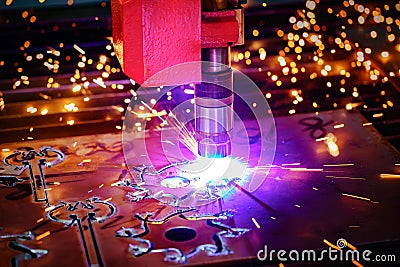 CNC Laser plasma cutting of metal, modern industrial technology. Stock Photo