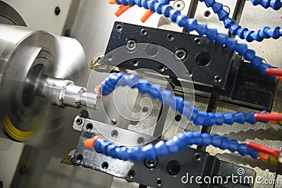 CNC lathe machine cutting the metal thread Stock Photo