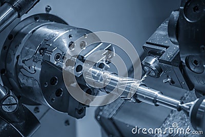 The CNC lathe machine slot cutting by the milling turret. Stock Photo