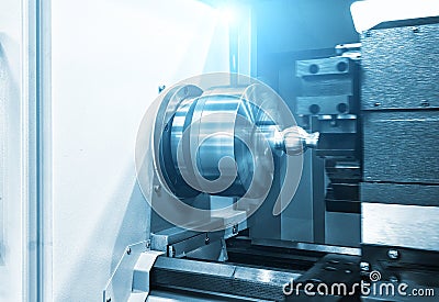 CNC lathe machine Turning machine cutting the metal thread part .Hi-precision CNC machining concept. Stock Photo