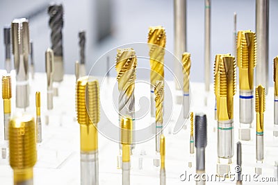 The CNC machine tapping tools for special purpose show in gold coating. Stock Photo