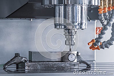 CNC machining tool setting center bar after cutting metal milling manufacturing industrial Stock Photo