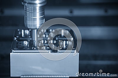 The CNC milling machine chamfer the mold part. Stock Photo