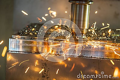 The CNC milling machine cutting the mold part . Stock Photo