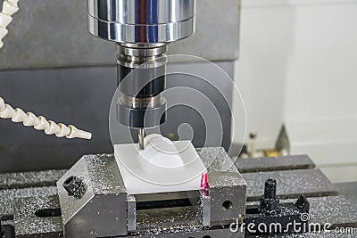 The CNC milling machine hi-precision cutting the plastic parts by solid ball endmill tool. Stock Photo