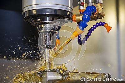 The CNC milling machine rough cutting the mould part with indexable radius endmill tool. Stock Photo