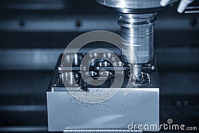 The CNC milling machine rough cutting the mould parts with the solid radius endmill tools. Stock Photo