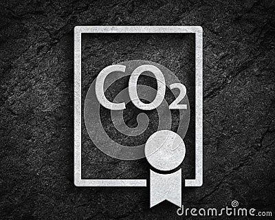 Co2 emissions trading license symbol stone wall background Stock Photo