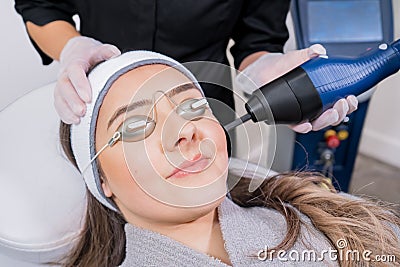 CO2 fractional ablative laser being used for skin rejuvenation skin resurfacing as a medical cosmetic procedure in a beauty Stock Photo