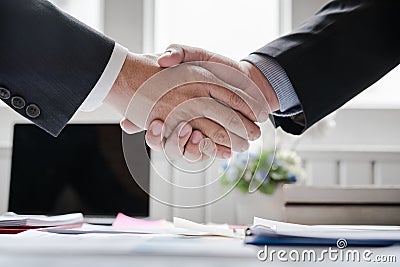 Co-investment business shaking hands successful deal after great meeting. Stock Photo