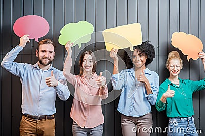 Co-workers with thought bubbles Stock Photo