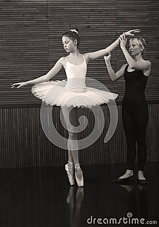 The coach teaches a small ballerina Stock Photo