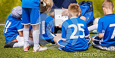 Coach Coaching Kids Soccer Team. Youth Football Team with Coach at the Soccer Stadium Editorial Stock Photo