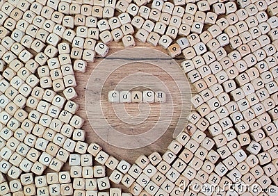 Coach, German text for Coach, word in letters on cube dices on table Stock Photo