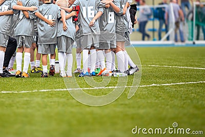 Coach giving young soccer team instructions. Youth soccer team Editorial Stock Photo