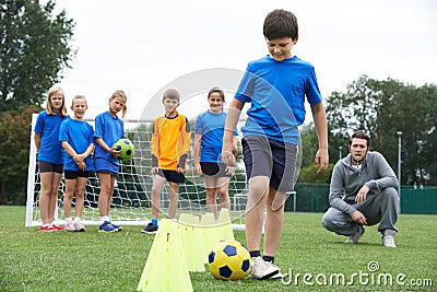 Coach Leading Outdoor Soccer Training Session Stock Photo