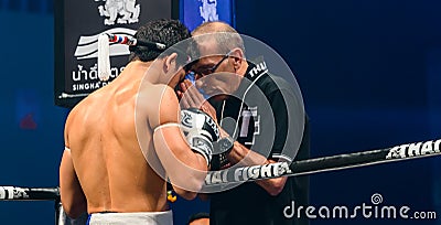 Coach Praying before the match for Antoine Pinto of France in Thai Fight Extreme 2013. Editorial Stock Photo