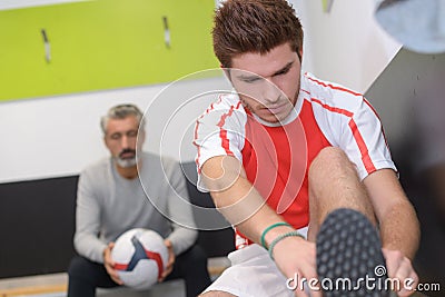 Coach sports team talking to soccer player Stock Photo