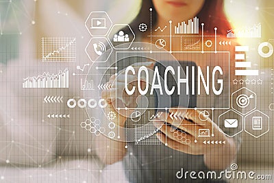 Coaching with woman using a smartphone Stock Photo