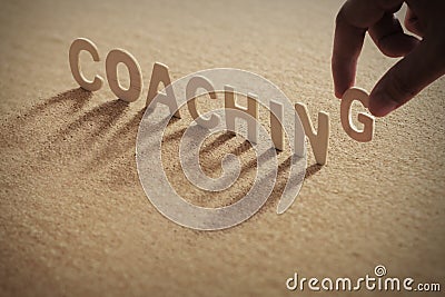 `coaching` wooden letters Stock Photo