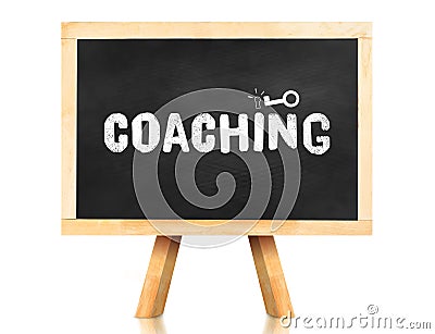 coaching word and key icon on blackboard with easel and reflection on white background,Business concept Stock Photo