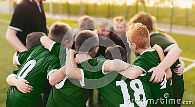 Coaching Youth Sports. Group Of Children In Soccer Team. School Football Coachâ€™s Pregame Speech. Young Boys United In Football Editorial Stock Photo