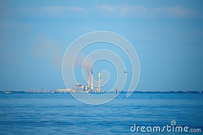 Coal burning electricity power plant station with smoking stacks Stock Photo
