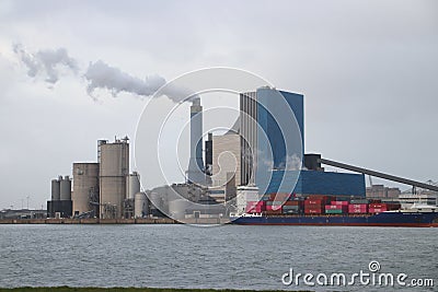 The coal energy power plant of Engie with steam coming out of the chimney. Editorial Stock Photo