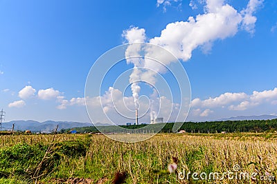 Coal fired electric power plant with agriculture field landscape. Hongsa city, Laos Stock Photo