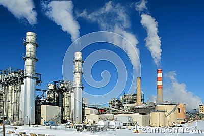 Coal Fossil Fuel Power Plant Smokestacks Emit Carbon Dioxide Pollution On A Cold Snowy Day Stock Photo
