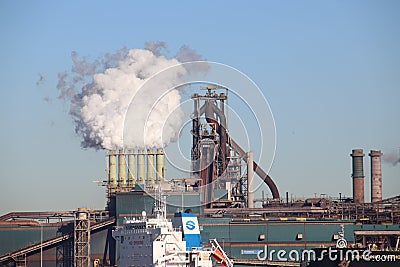 Coal and iron ore are unloaded at sea ships at the steel factory of Tata in IJmuiden the Netherlands. Editorial Stock Photo