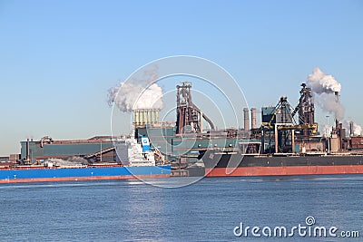 Coal and iron ore are unloaded at sea ships at the steel factory of Tata in IJmuiden the Netherlands. Editorial Stock Photo