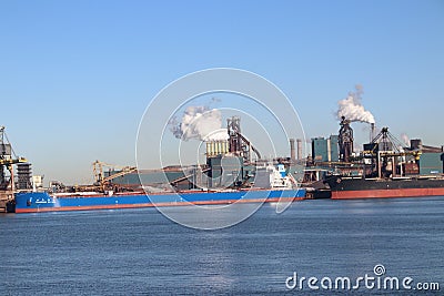 Coal and iron ore are unloaded at sea ships at the steel factory of Tata in IJmuiden the Netherlands. Editorial Stock Photo