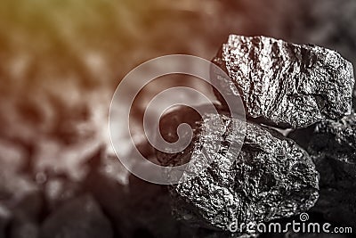 Coal mining industry. Natural black coals for background. Coal in the miner hands. Volcanic rock. Stock Photo