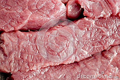 Coarsely chopped pieces of beef. The concept of cholesterol food. Raw meat Stock Photo