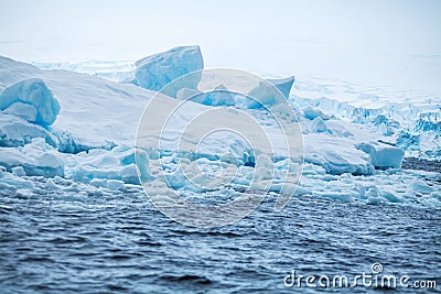 Coast Antarctica with ices and icebergs of unusual forms, colors Stock Photo