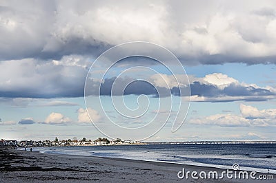 The coast of the Atlantic Ocean. People walking along the shore. Normal view of Maine. USA, Stock Photo
