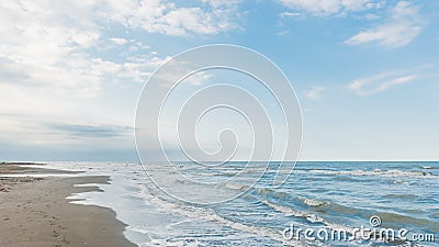 Coast, cloudy weather, waves on the sea Stock Photo