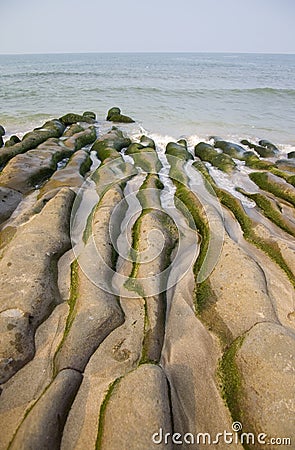 Coast erosion of the waves Stock Photo