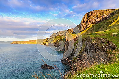 Coast with green grass nearby a carrick-rede-rob, Northern Ireland, UK. Stock Photo