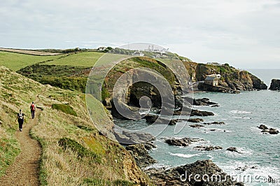 Coast Path near Polpeor Cove Lifeboat Station and Lizard Lighthouse, The Lizard, Cornwall, England, UK Editorial Stock Photo