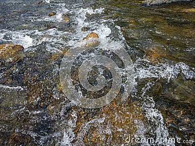 Coast stones with white spray. Rock in waterfall with heavy flow water, Can use to display, montage or retouch on Product Design, Stock Photo