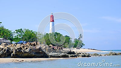 The Coast Of Tanjung Kalian, With The Lighthouse And Large Rocks Stock Photo